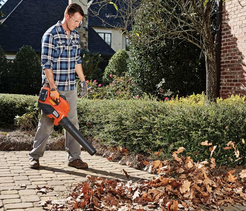 man using electric leaf blower