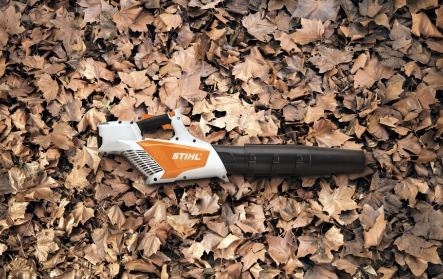 Stihl leaf blower on pile of leaves