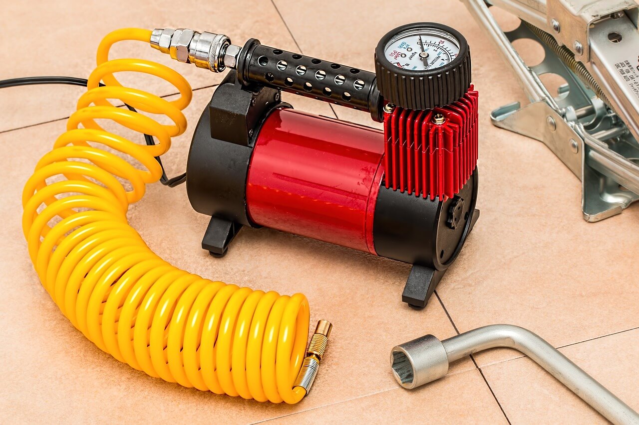 red air compressor with yellow hose