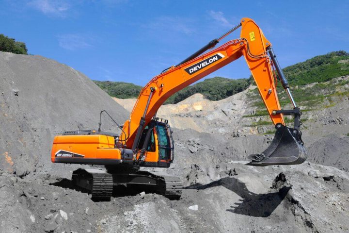 Develon DX225 excavator on pile of gravel