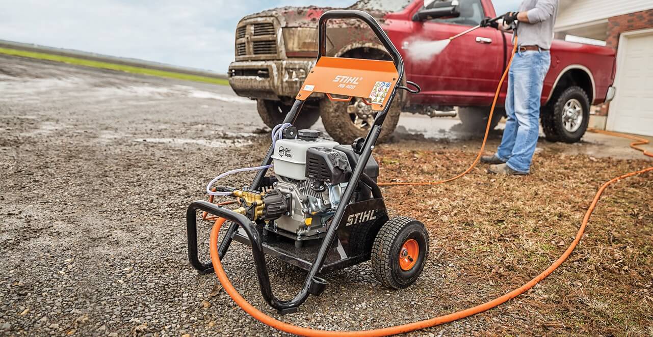 man washes car Stihl pressure washer